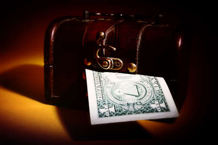 Wood cashbox isolated on brownの写真素材
