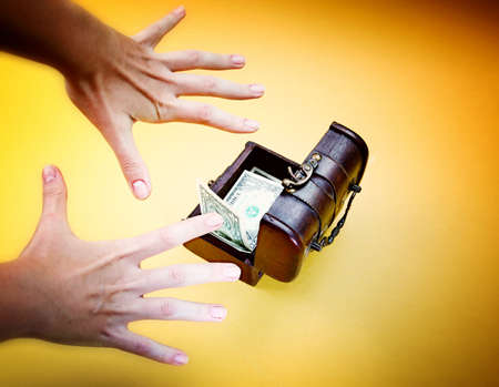 Wood cashbox isolated on yellowの写真素材