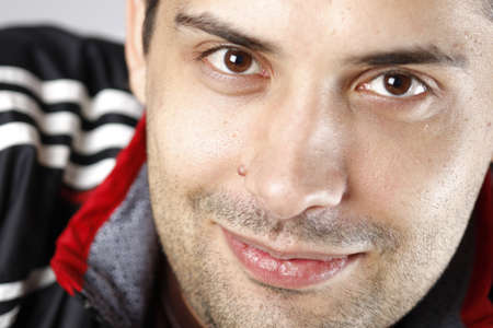 Close up photo of a young happy man
