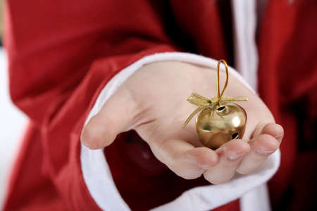 Santa clause with ringer in his hands.の写真素材
