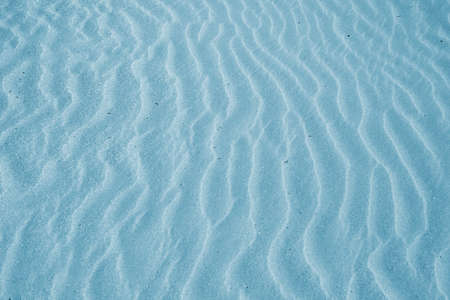 Beach with soft sand, rippled texture of windblown effectの写真素材