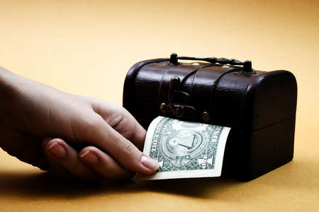 Wood cashbox isolated on yellowの写真素材