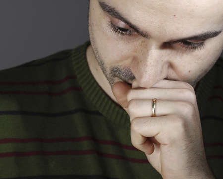 Portrait of a young man, isolated on background