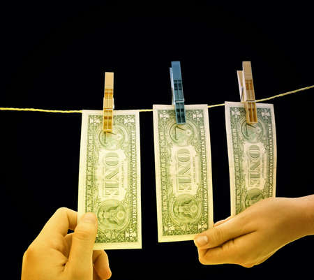 Dollars on the wire isolated on blackの写真素材