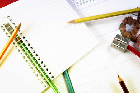 Close-up of color pencils and agenda