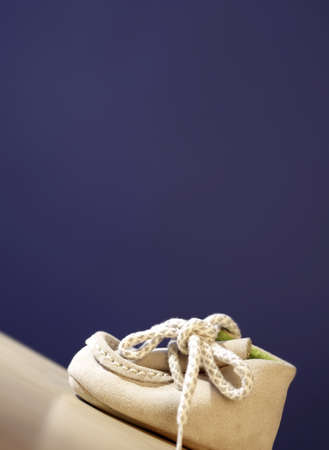 Close up photo of a pail of small slippers for toddlersの写真素材