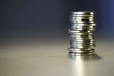 Big tower of money isolated on blurry backgroundの写真素材