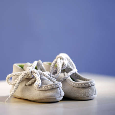 Close up of a pail of small slippers for toddlers