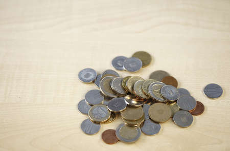 Lot of money on a brown deskの写真素材