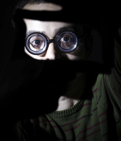 Portrait of a young man, isolated on black backgroundの写真素材