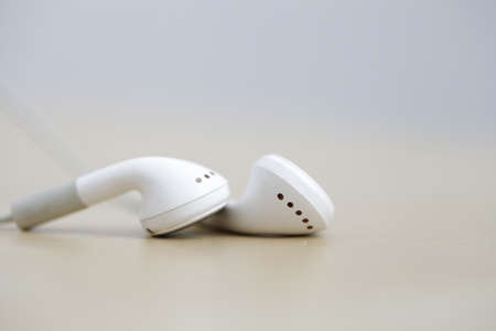 Modern and small earphones on a desk