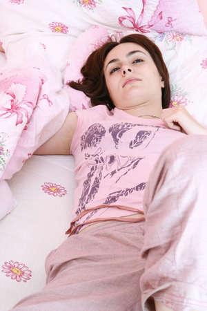 Young beautiful woman waking up in the morning .