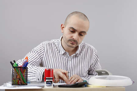 Young businessman at his deskの写真素材