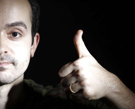 Portrait of a young man, isolated on black background