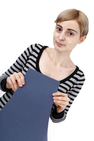 Young blonde woman holding a blank piece of paper.の写真素材