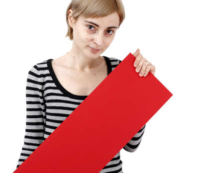 Young blonde woman holding a blank piece of paper.の写真素材