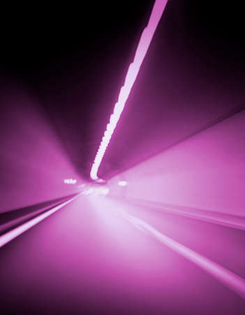 Car lights trails in a tunnelの写真素材