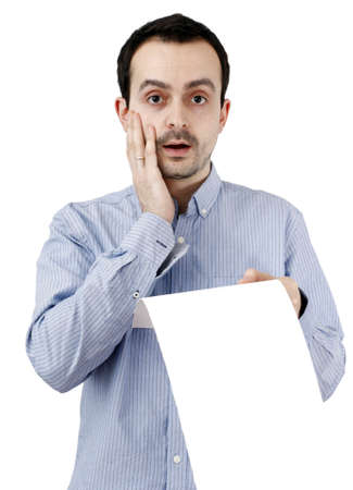 Young man holding a blank piece of paperの写真素材