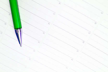 Close-up of color pencils and agendaの写真素材