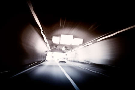 Car lights trails in a tunnel blurの写真素材
