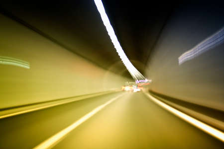 Car lights trails in a tunnelの写真素材