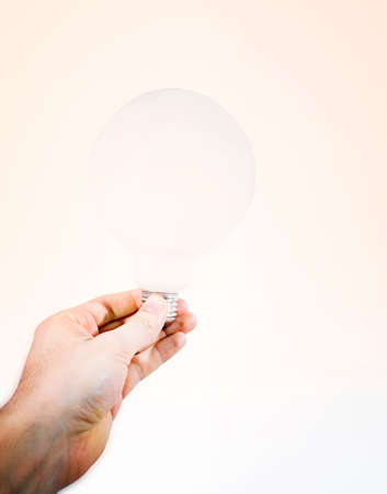 White bulb in a man's hand