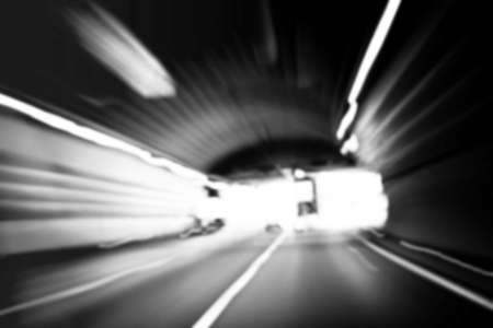 Car lights trails in a tunnelの写真素材