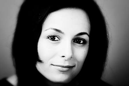 Portrait of a happy beautiful woman with green eyes.の写真素材