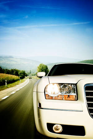 White limo on the highwayの写真素材