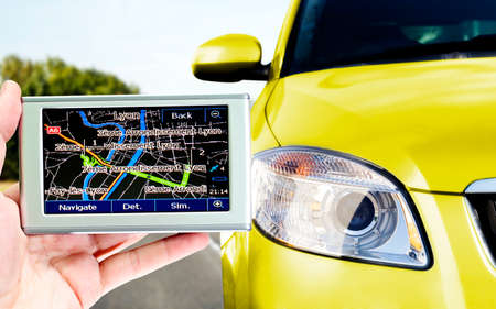 Gps in a man hand. Find your way !の写真素材