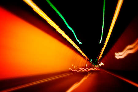 Car lights trails in a tunnelの写真素材