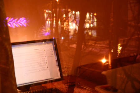 my pc monitor in reflexions in my windowの写真素材