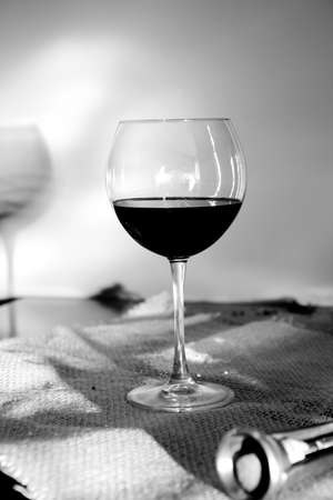 glass of red wine on my tableの写真素材