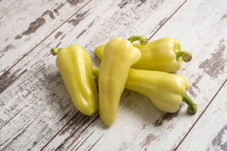 Green sweet pepper on vintage painted tableの写真素材