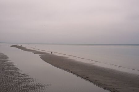 Isolated beach on Baltic sea in winterの写真素材