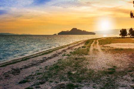 Tambo island at sunset from Lourido beach, Poio town, at sunsetの写真素材