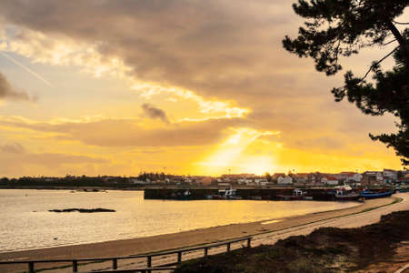 Cabodeiro fishing port in Arousa Island at sunsetの写真素材