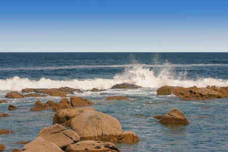 Waves beating against the coastal rocks on the cliffs of Cies Islands