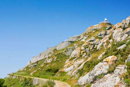 Mountain with lighthouse on top in Montefaro island, Cies archipelago
