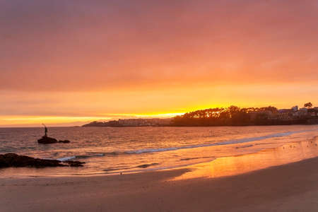Red sunset over Silgar beach in Sanxenxoの写真素材