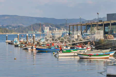 Fishing boats moored on the dock of Combarro villageの写真素材