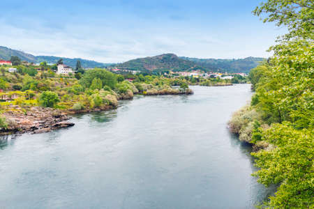 Water and vegetation of Minho river  as it passes through Ourenseの写真素材