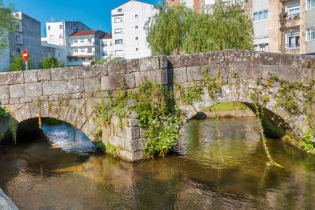 Roman bridge over Bermanha river passing through Caldas de Reis cityの写真素材