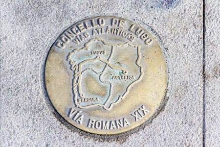 Signaling Roman road XIX passing through the streets of Lugoの写真素材