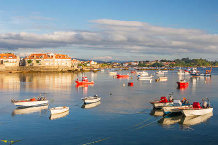 Boats anchored on Campo fishing port in Arousa Island