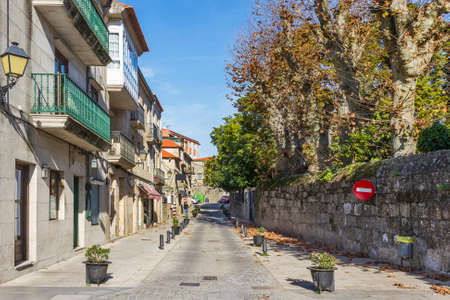 Buildings and wall on Principe street in Cambados cityの写真素材