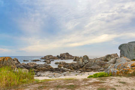 Dune and coastal rocks on Con Negro beach in San Vicente, O Grove town