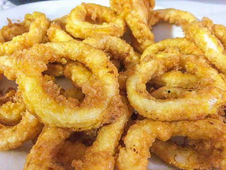 Fried slices of squid breaded in eggの写真素材