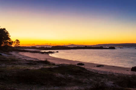 Area da Secada beach and dunes in Arousa Island at golden duskの写真素材