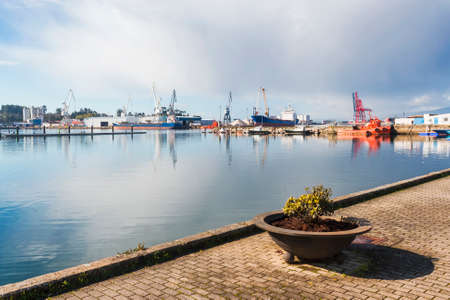 Vilagarcia de Arousa commercial harbor on calm seaの写真素材